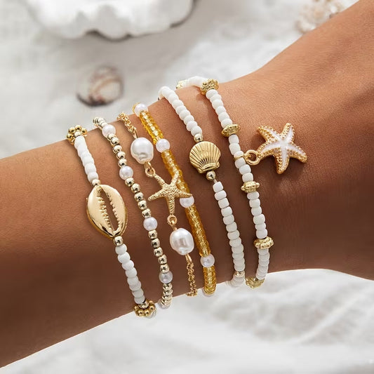 Zestaw 6 złotych bransoletek plażowych